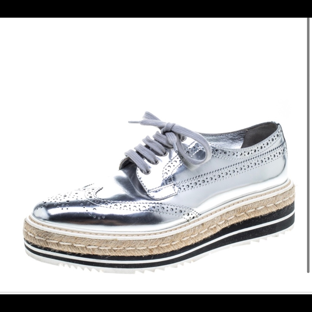 PRADA Silver wingtip espadrille.